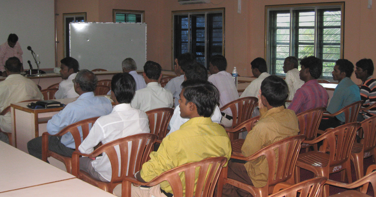 A group of believers listening to a speaker