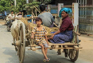 Burmese people traveling by cart