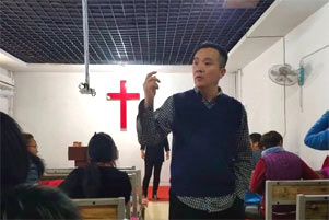Pastor Geng Zejun in a church