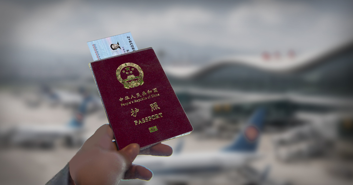 A man is holding out a passport for China and a card that is similar in appearance to a North American driver's license.