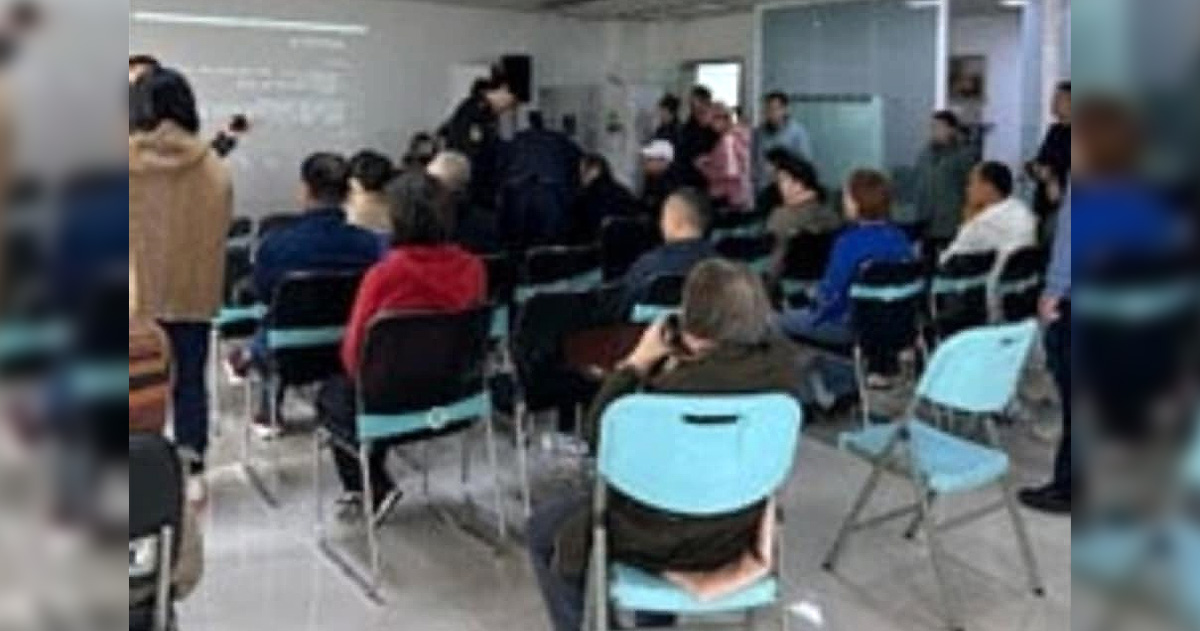 Beijing Zion Church members are gathered together, sitting on chairs.