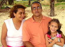 Carlos Lamelas with his wife and daughter