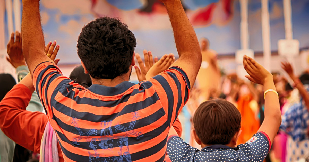 Worshippers have their hands raised in worship. Worshippers have their hands raised in worship.