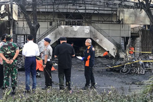 President Joko Widodo (in white) visited one of the churches that were attacked.