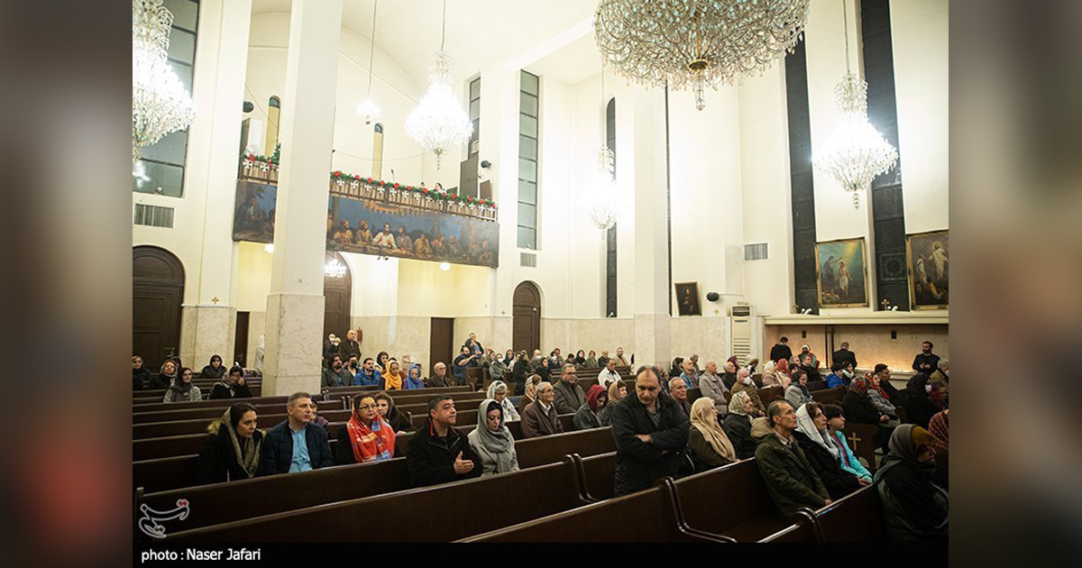 People are gathered in a large church.