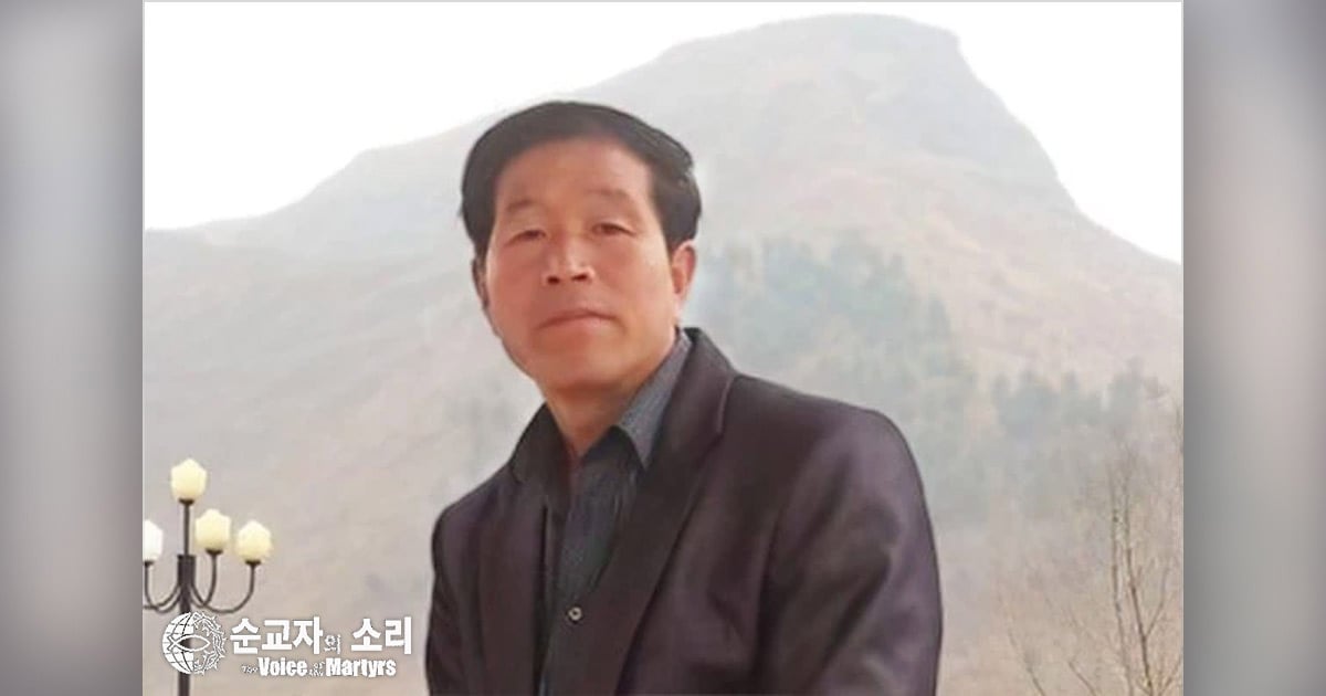 A hill is behind Deacon Jang Moon Seok. A hill is behind Deacon Jang Moon Seok.