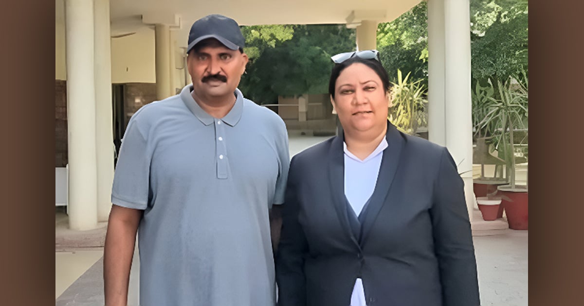 Haroon is standing with his lawyer in a portico. Haroon is standing with his lawyer in a portico.