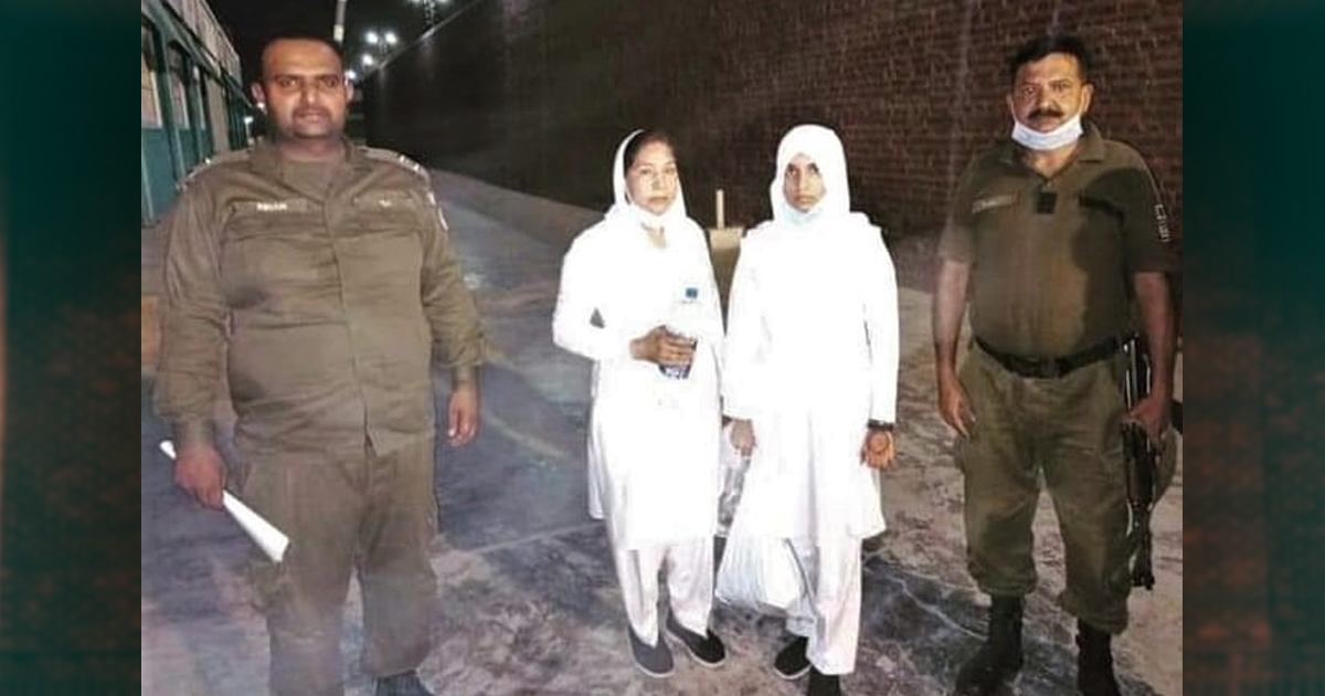 Maryam Lal and Navish Arooj with officers - Photo: Morning Star News