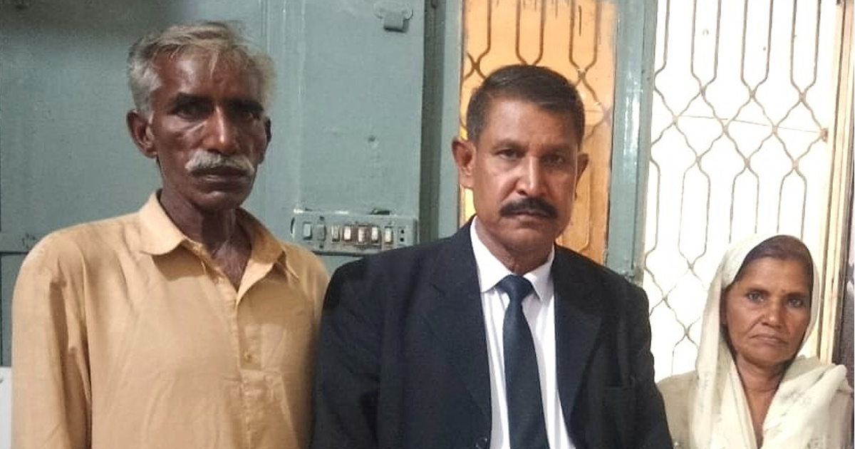 Attorney Hanif Hameed is standing between the parents of unnamed 15-year-old.