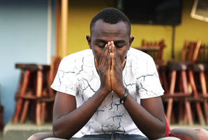 Ugandan man praying