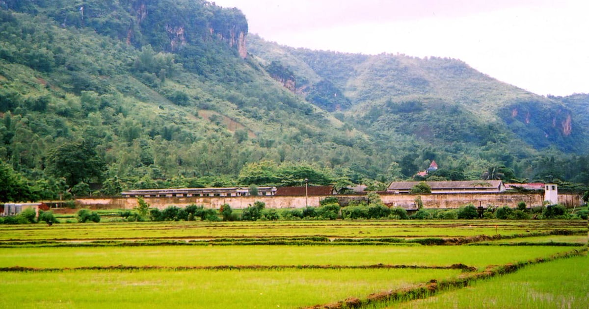 A prison is in an open area next to mountains in Vietnam.