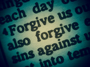 Close-up image of a portion of the Lord's Prayer - ''Forgive us... also forgive... sins against...''